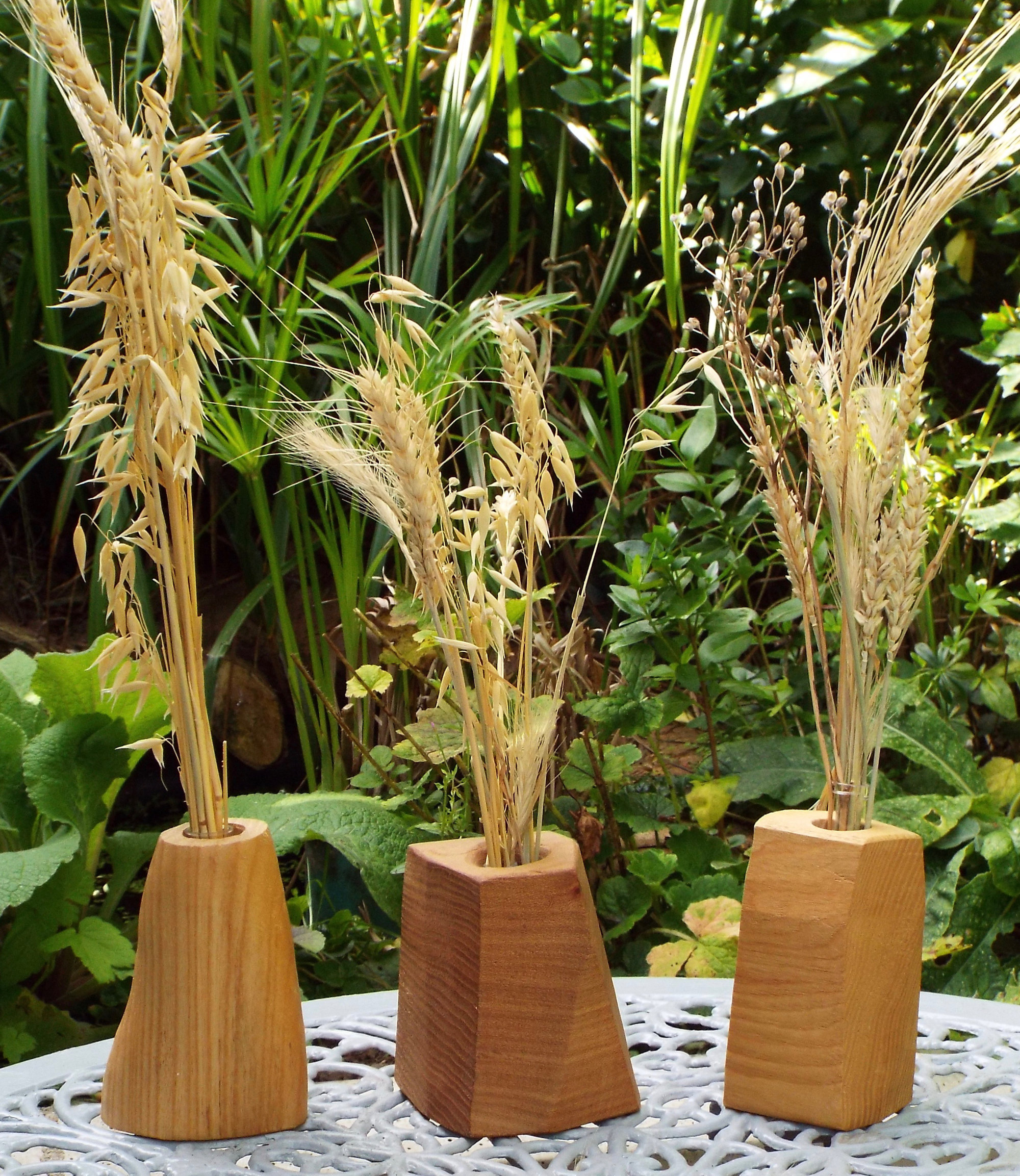Wooden bud vases by Richard Woodgate.
